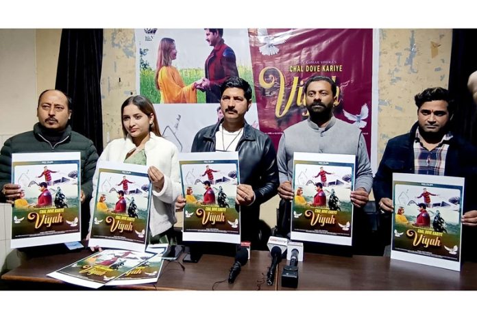 Chairman Samvedna Society, Keshav Chopra along with others releasing Album 'Chal Dove Kariye Viyah' at Jammu on Sunday. Chairman Samvedna Society, Keshav Chopra along with others releasing Album 'Chal Dove Kariye Viyah' at Jammu on Sunday.