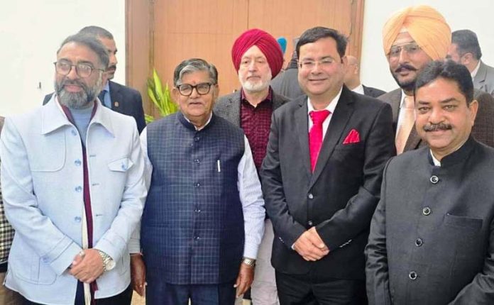 Dr Anshu Kataria posing along with Governor of Punjab, Gulab Chand Kataria during a function.