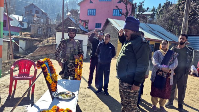 A CRPF officer paying his respect to braveheart Ct Mool Dev Sharma on his martyrdom anniversary at Duggli in Doda district. A CRPF officer paying his respect to braveheart Ct Mool Dev Sharma on his martyrdom anniversary at Duggli in Doda district.