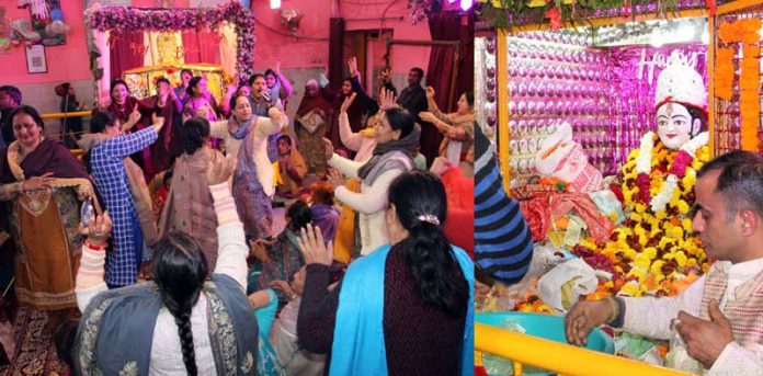 Female devotees dancing on bhajans of Bawa Lal Ji in his temple located at Jain Bazaar, Jammu. -Excelsior/Rakesh