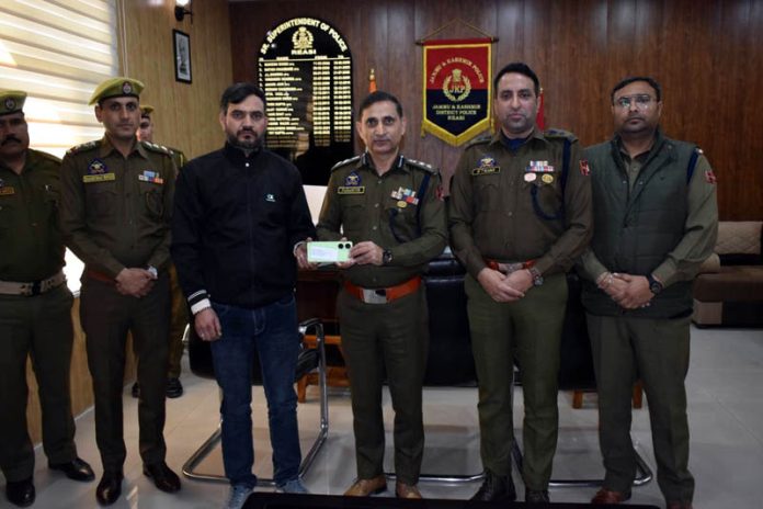 SSP Reasi handover recovered mobile phone to its owner.