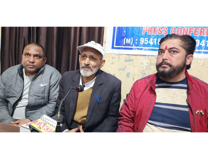 Office bearers of J&K Tourist Trade Peoples Federation addressing a press conference at Jammu on Friday.