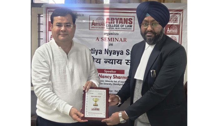 A dignitary presenting guest with memento at Aryans Group of Colleges in Chandigarh on Thursday.