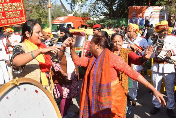BJP workers celebrating the party’s victory in Delhi Assembly election, in New Delhi on Saturday. (UNI)
