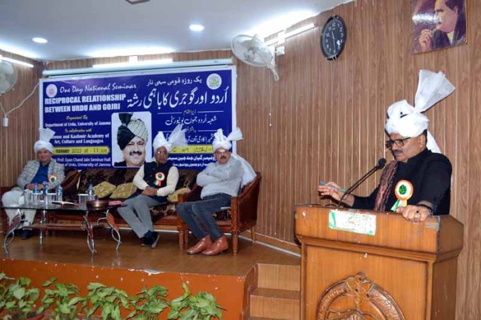 Minister Javed Ahmed Rana addressing during a function organised in Jammu on Monday.