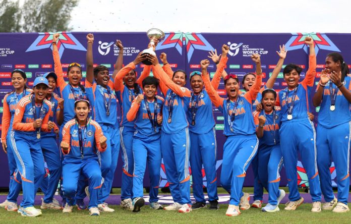 Indian Under-19 Women’s cricket team posing with World Cup trophy. Indian Under-19 Women’s cricket team posing with World Cup trophy.