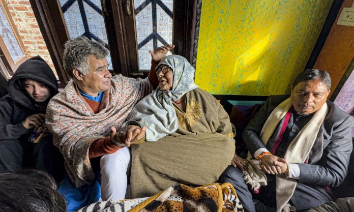 J&K BJP President Sat Paul Sharma and party leader Ravinder Raina meet family members of ex-armyman who was killed by militants, in Kulgam