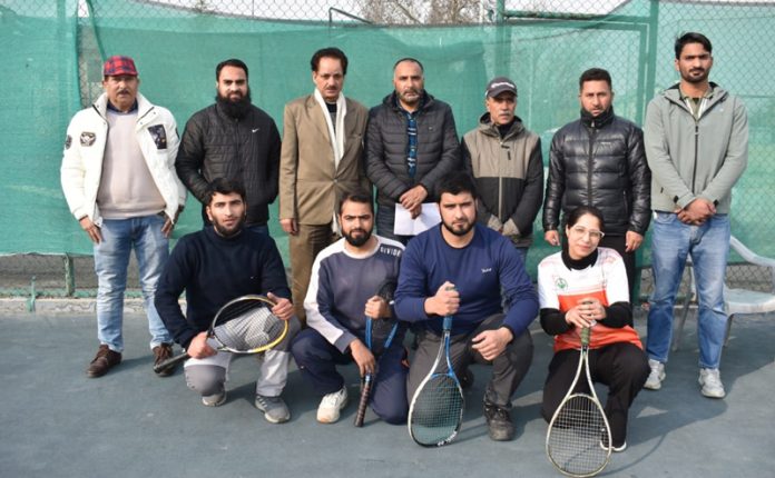 Players posing with selection committee members.