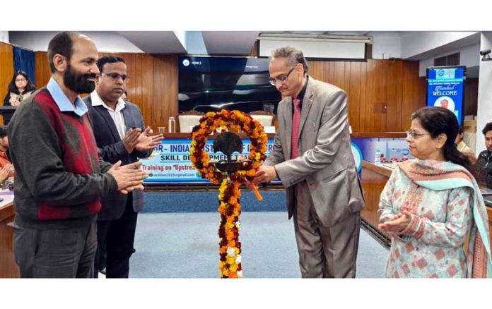 Dr Sanjay Bhasin lights ceremonial lamp during inaugural of training programme at IIIM.