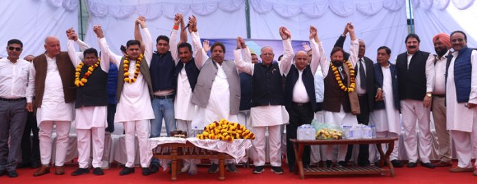 Senior Cong leaders raising hands as show of unity during convention at Muthi in Jammu on Sunday. -Excelsior/Rakesh