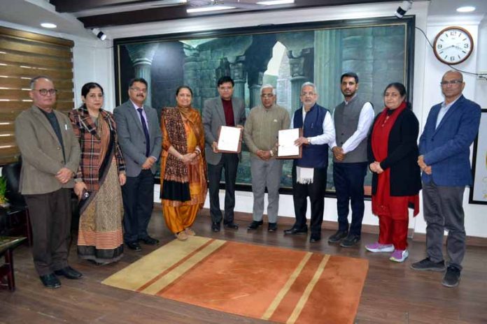 JU Registrar and CEO Agrinnovate India Ltd display copies of MoU in presence of Vice-Chancellor Prof Umesh Rai and others. JU Registrar and CEO Agrinnovate India Ltd display copies of MoU in presence of Vice-Chancellor Prof Umesh Rai and others.