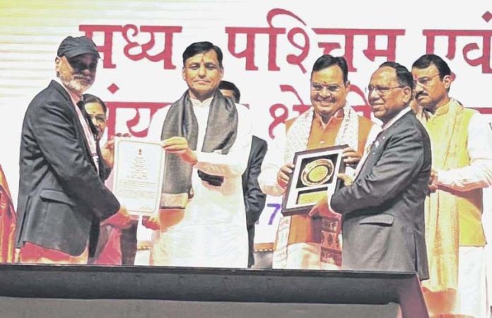 Raj Kumar Chaudhary, CMD, NHPC receiving an award during a function held on Monday.