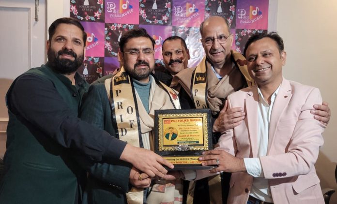 Minister and Advisor to CM releasing a book.