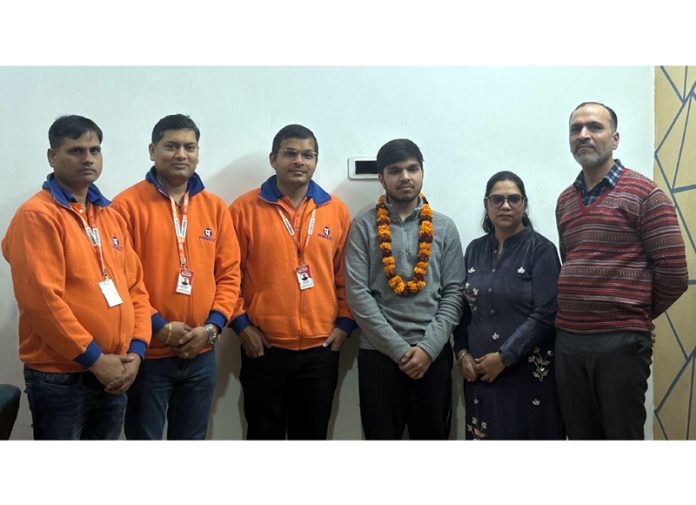 Toppers of Padhoji institute posing along with the faculty in Jammu on Wednesday.