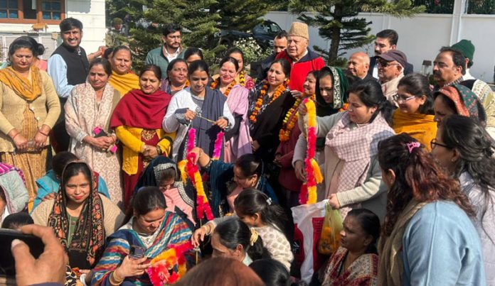 Dr Farooq Abdullah, president of JKNC, posing with the members of women delegation in Jammu on Monday.