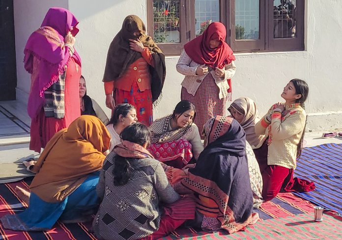 Relatives of Army's Naik Mukesh Singh Manhas mourn while waiting for his mortal remains, in Samba district, Jammu and Kashmir.