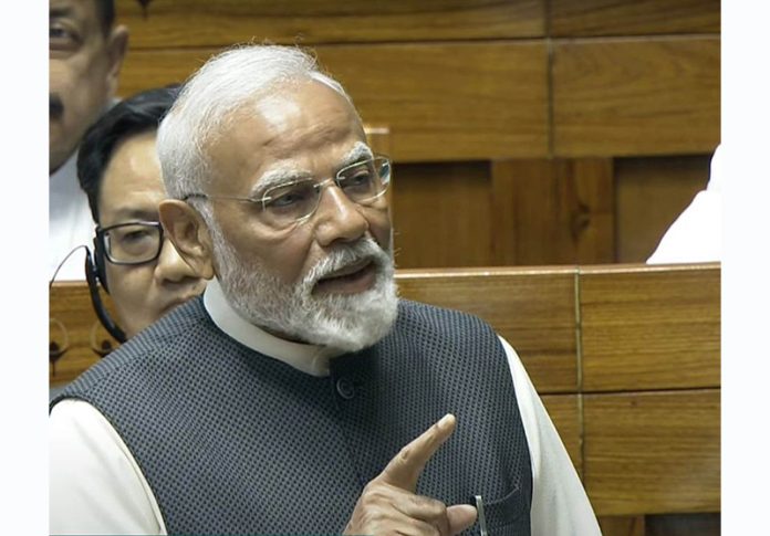 Prime Minister Narendra Modi speaking in the Lok Sabha on Tuesday. (UNI)