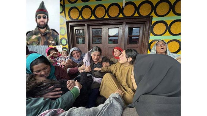 Family members and others wail after the death of ex-serviceman. (Inset) Manzoor Ahmad Wagay. -Excelsior/Sajad Dar