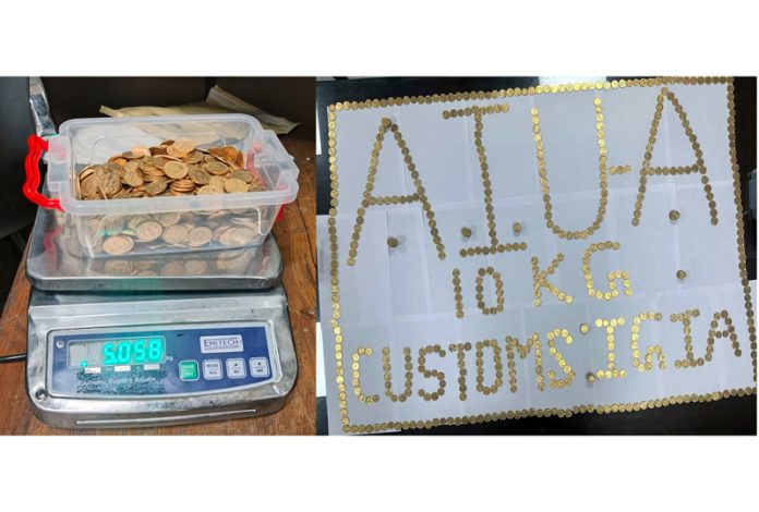 Coins seized at Delhi Airport.