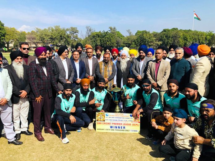 The winning team posing for a photograph with dignitaries during post-match presentation ceremony at Jammu.