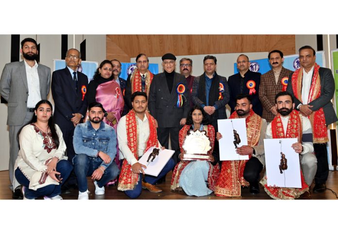 Trekkers posing along with awards during a programme at Jammu. Trekkers posing along with awards during a programme at Jammu.