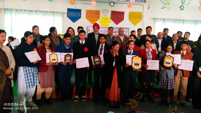 Students of Jammu Sanskriti School Kathua posing along with dignitaries during a programme at Kathua.