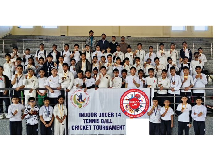 Players posing for a group photograph during tournament in Jammu.