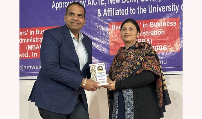 Dr. Meenakshi Sharma, Director of IMS Jammu presenting memento to dignitary.