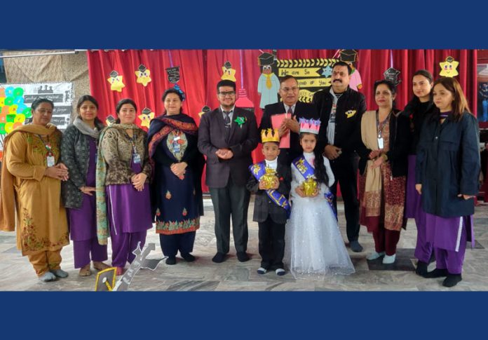 School management with graduating pre-primary students during the ceremony.