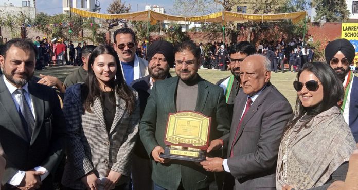 School management presenting a memento to Sports Minister Satish Sharma during Annual Sports Meet at Lawrence Public School.