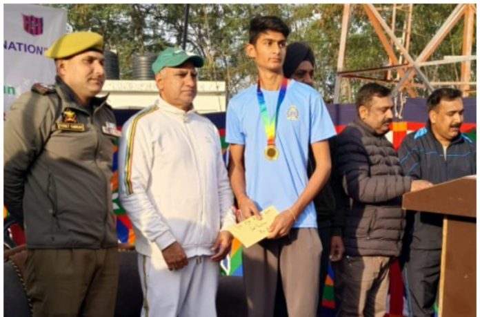 Dignitary presenting a medal and certificate to winner at Marathon event in Akhnoor. Dignitary presenting a medal and certificate to winner at Marathon event in Akhnoor.