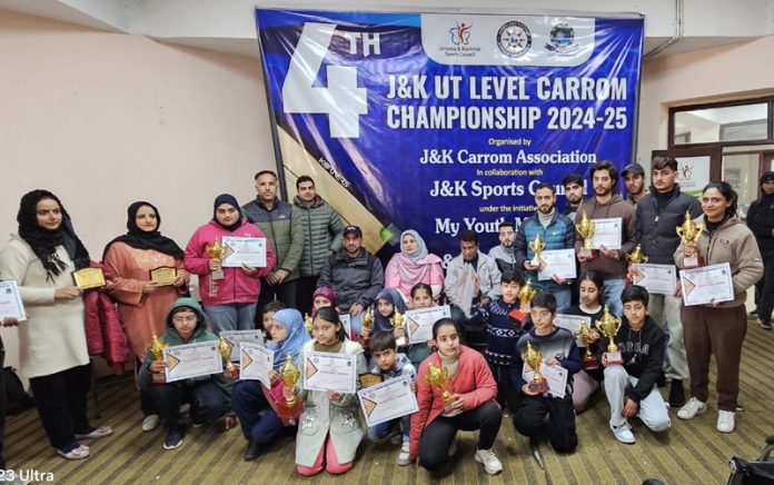 Dignitaries posing with Carrom players during closing ceremony of Carrom Championship at Sher-i-Kashmir Indoor Sports Complex, Srinagar.