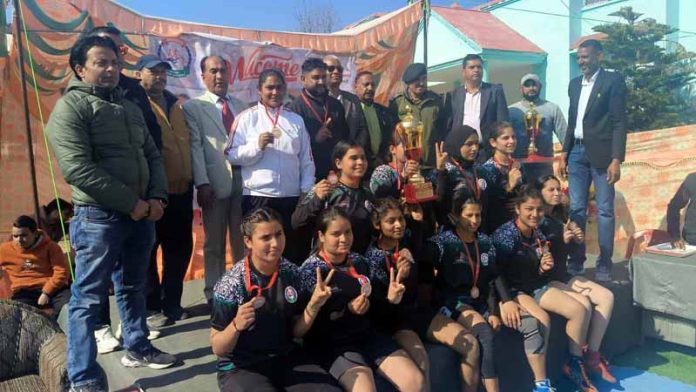 Winning Kabaddi team posing along with dignitaries during a Championship at Poonch.