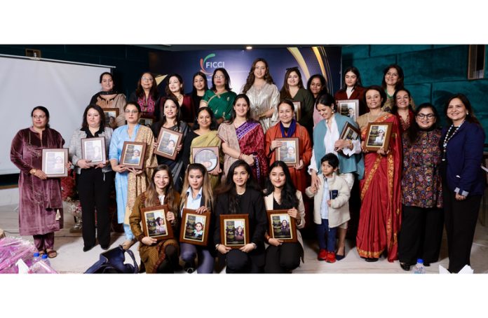 Mandeep Kaur, Commissioner Secy posing along with the women achievers during an event held in Jammu on Saturday.