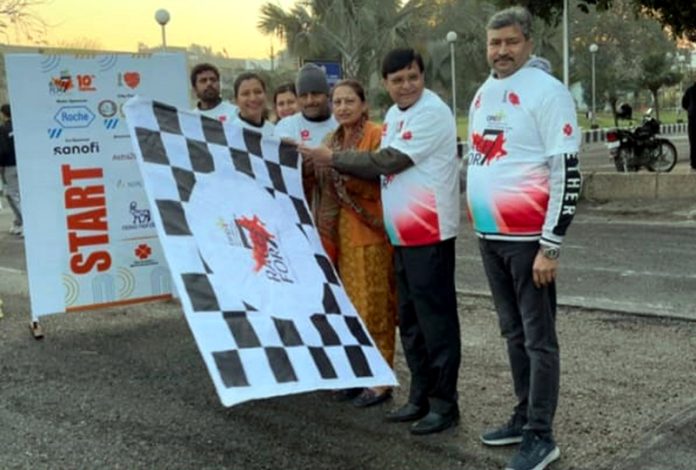 Dignitaries flagging off a marathan and Walkathon at Jammu University on Sunday.
