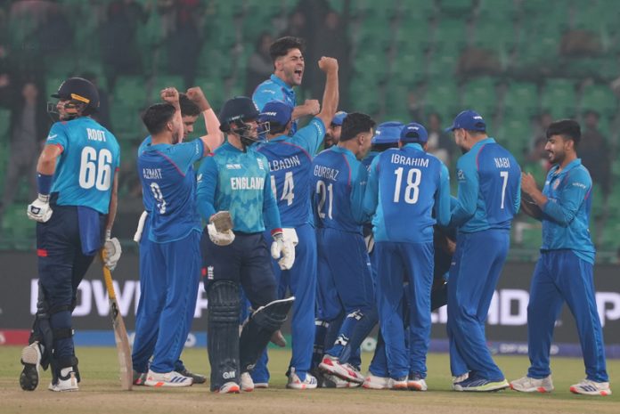 Afghanistan team celebrating after defeating England by 8 runs at Lahore.