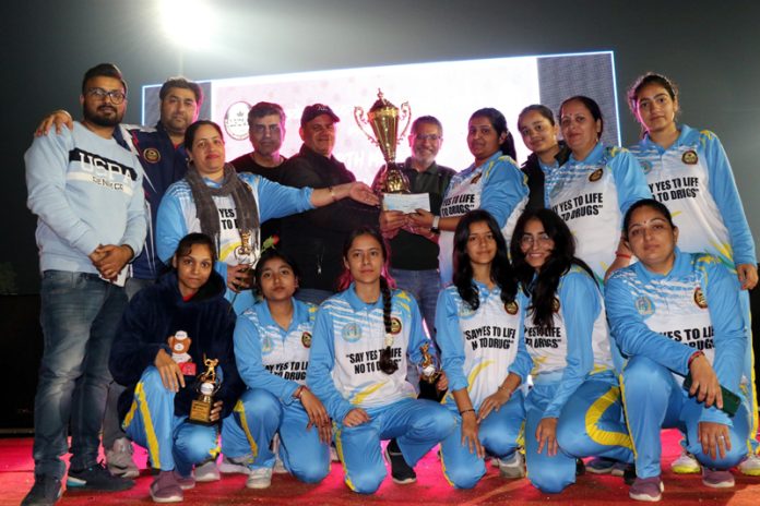 Winning team posing with trophy and dignitaries during post match presentation. Winning team posing with trophy and dignitaries during post match presentation.