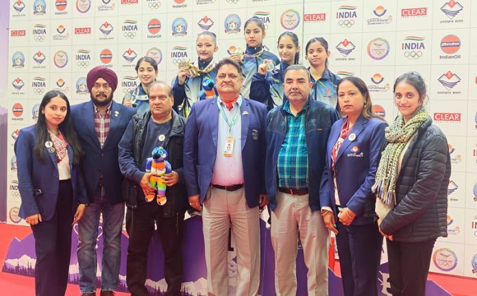 J&K Gymnastics team with dignitaries and supporting staff at National Games.