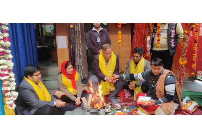 Management of Shiksha Niketan High School performing a havan during 56th Foundation Day celebration.