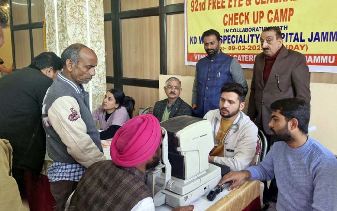 Doctors checking the patients during an eye check up camp in Jammu on Monday.