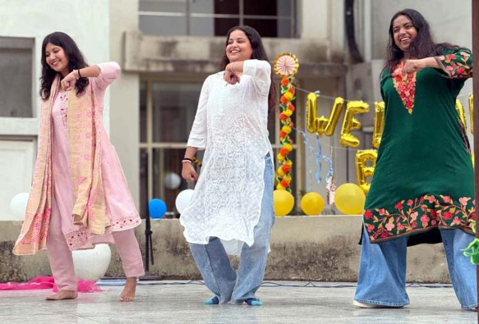 Students present a dance item during alumni meet by IIMC Jammu on Monday.