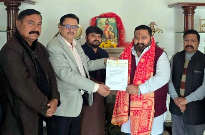 Sunil Bharala, National Founder of RPP felicitating Chandan Datta during a function in Jammu on Monday.