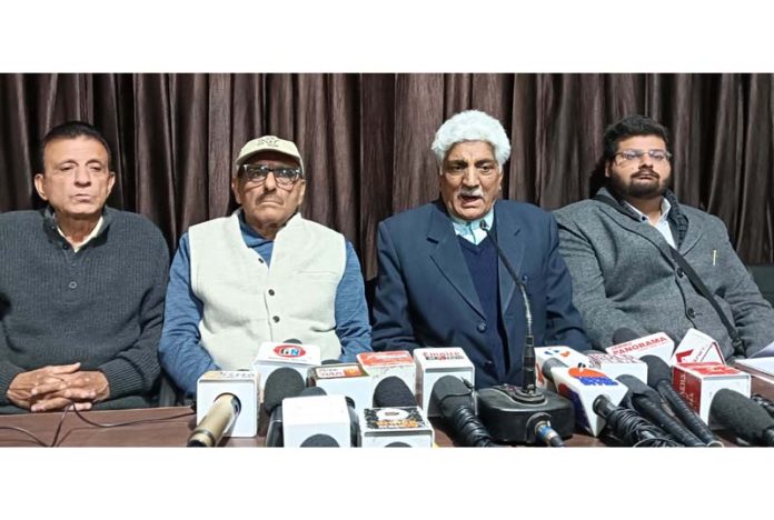 Members of Roopnagar JDA Housing Colony Welfare Association addressing press conference on Monday. -Excelsior/Rakesh