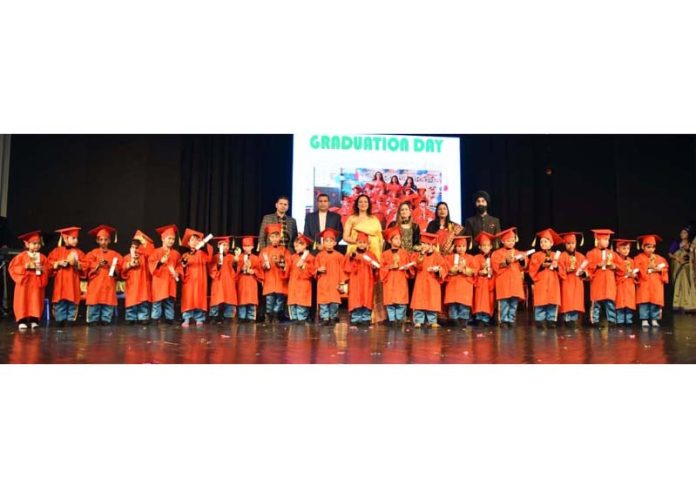 Students of Hello Kids Playway School alongwith others posing for a group photograph.