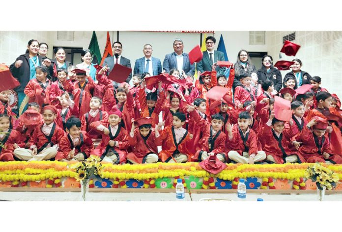 Students of MV International School along with dignitaries posing for a group photograph.