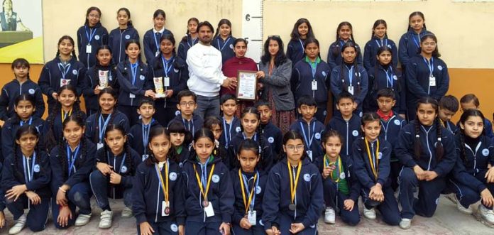 Students posing for a group photograph during a programme. Students posing for a group photograph during a programme.