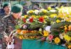 A senior Army officer laying wreath on the mortal remains of martyred soldiers at Jammu airport.
