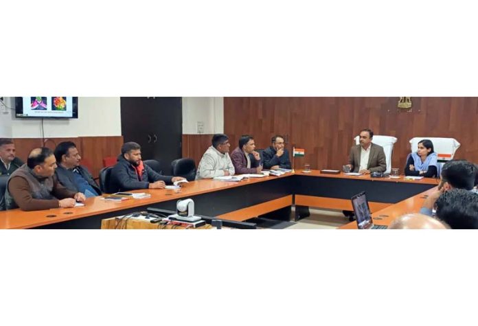 Div Com Ramesh Kumar chairing a meeting at Reasi on Thursday.