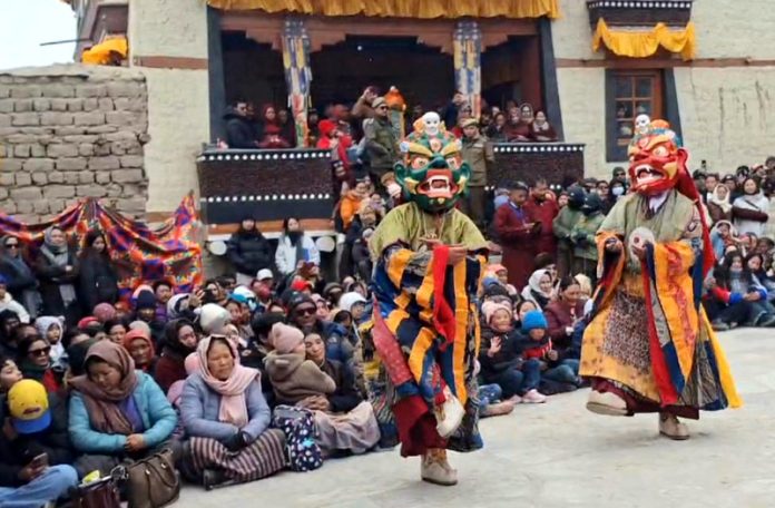 Monks of Hemis monastery performing mask dance in Leh on Wednesday.