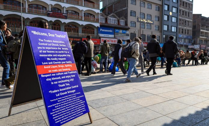 Traders erect signboard, urging tourists not to use alcohol and drugs, at Lal Chowk in Srinagar on Friday. -Excelsior/Shakeel Traders erect signboard, urging tourists not to use alcohol and drugs, at Lal Chowk in Srinagar on Friday. -Excelsior/Shakeel